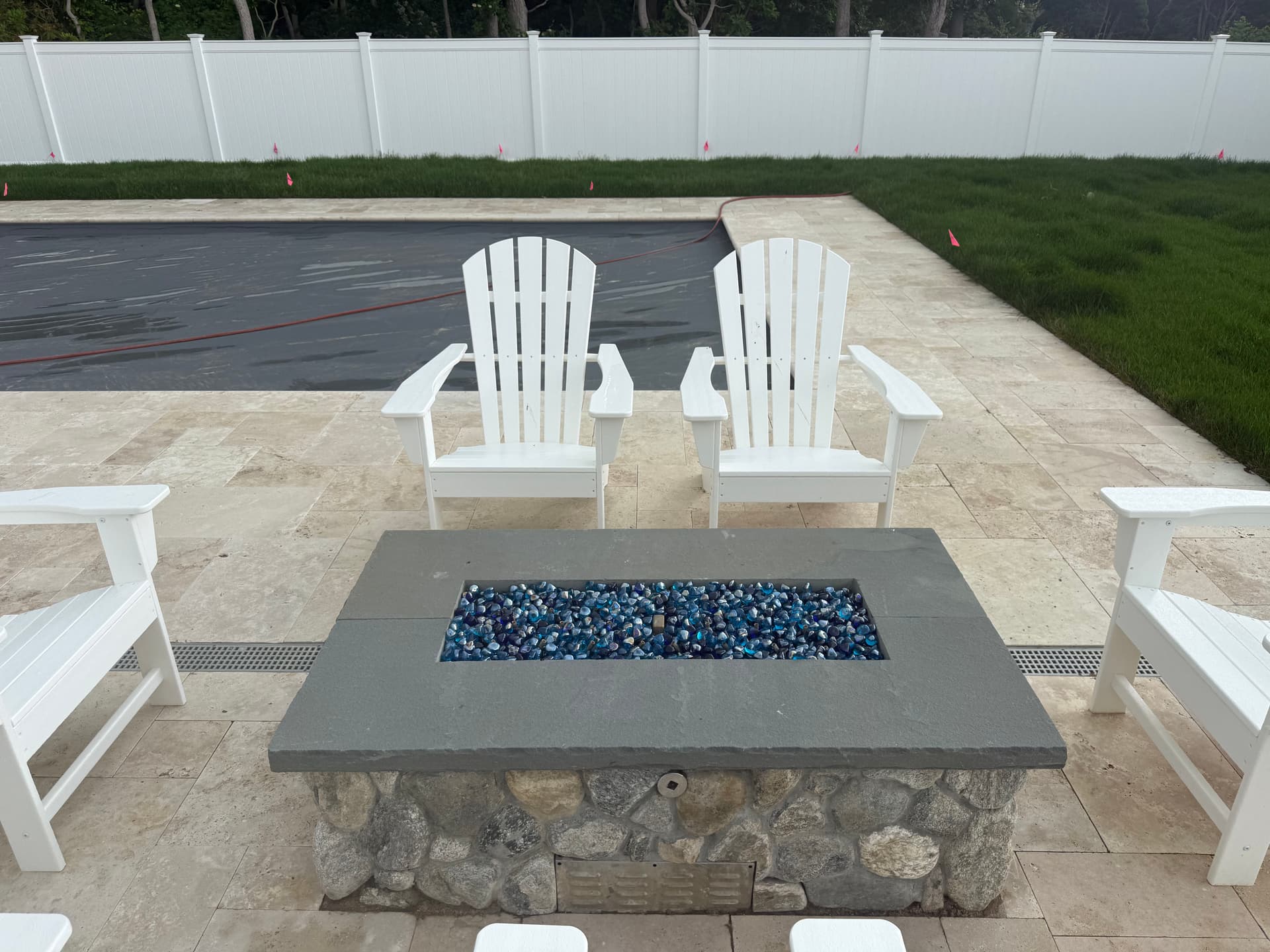 Gallery photos for Poolside Fire Pit Built with Round Fieldstone and Bluestone Cap: Image #1
