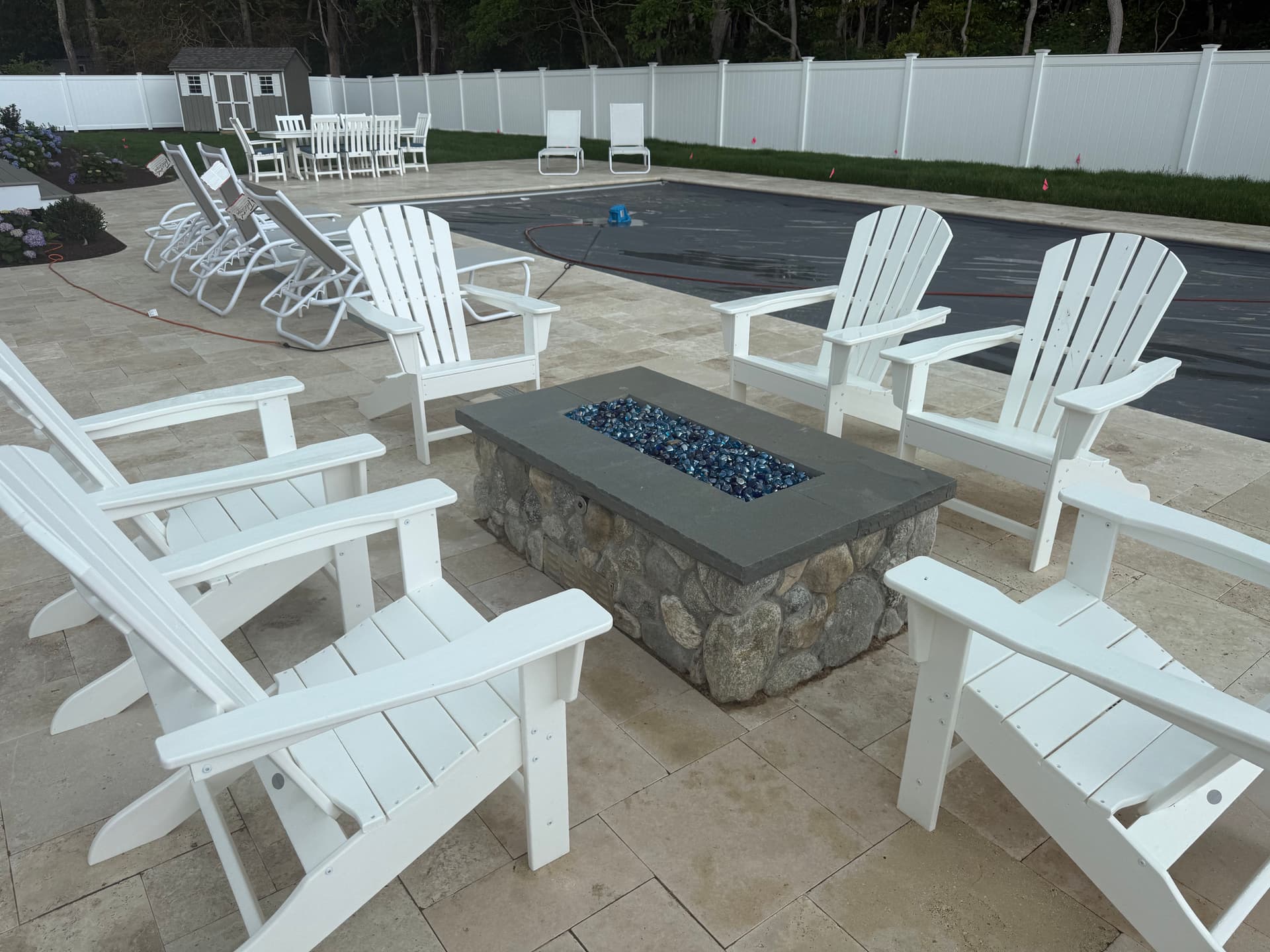 Gallery photos for Poolside Fire Pit Built with Round Fieldstone and Bluestone Cap: Image #2
