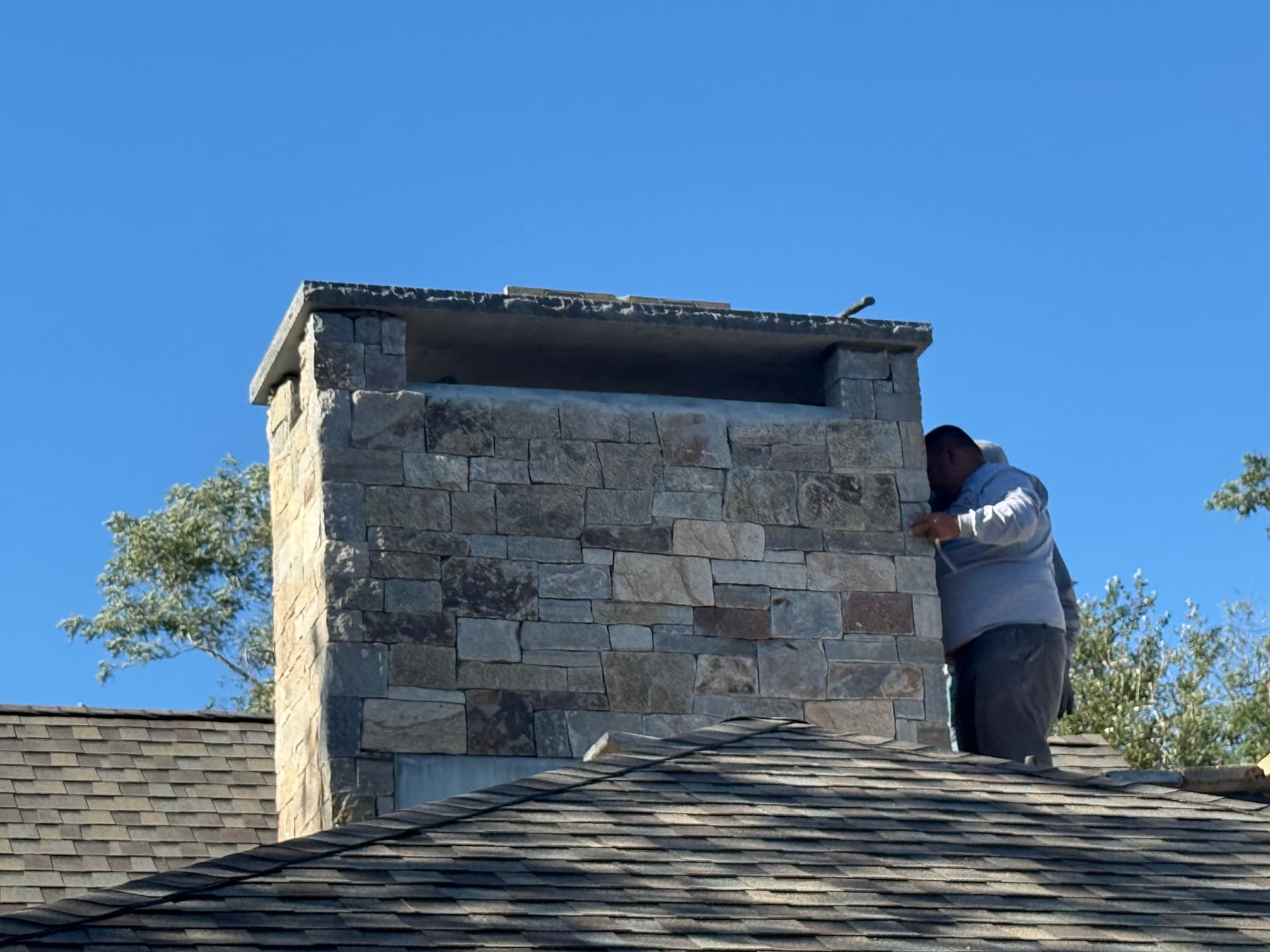 Custom Stone Chimney Build with Granite Cap in Dennis MA image
